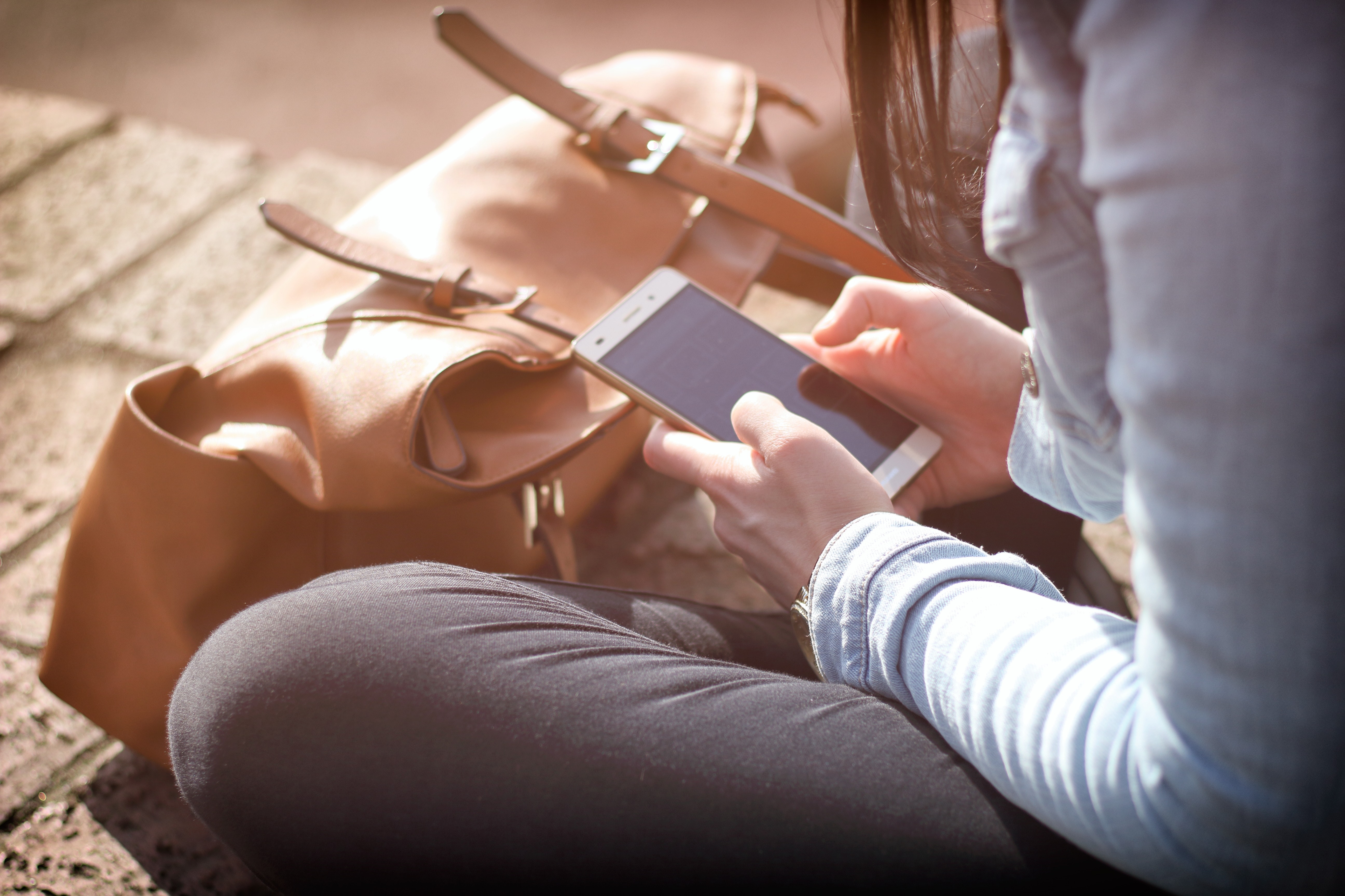 girl using her mobile phone